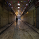 A Palestinian man walks down an empty street during a full strike in Nablus, West Bank.